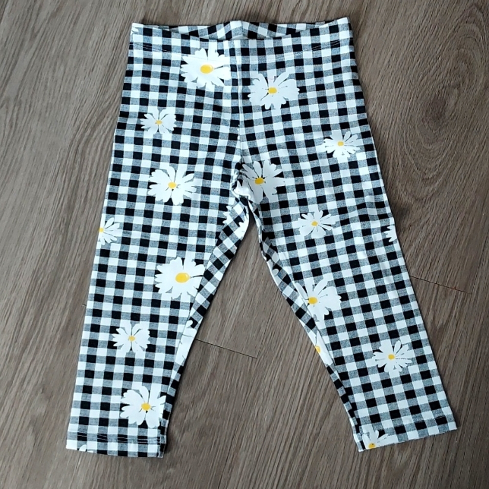 Wonder Nation black/white checkered pants with dandelions print throughout small